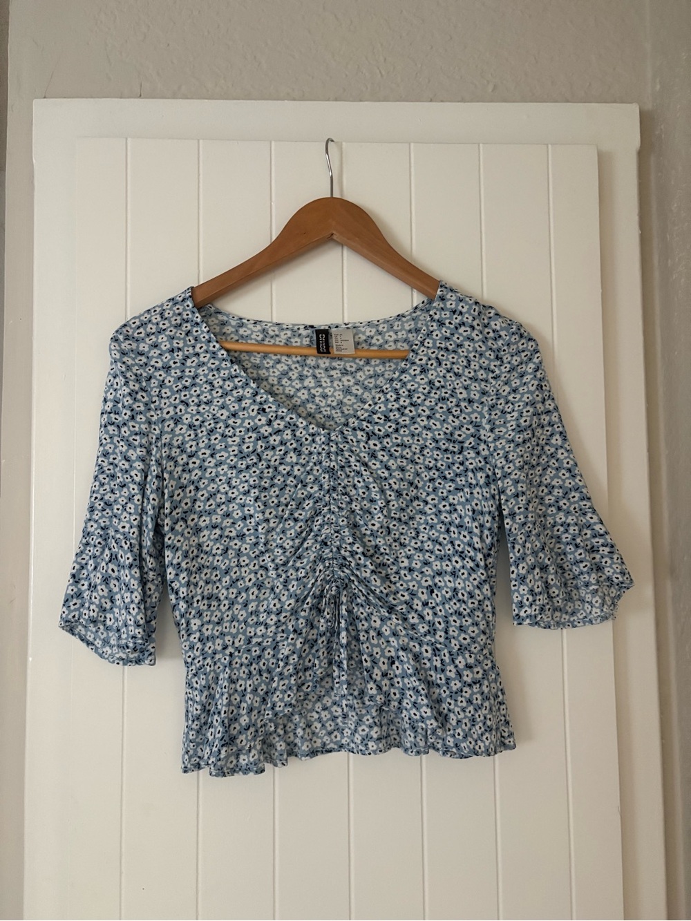 Divided Light Blue Floral Ruched Peplum Top